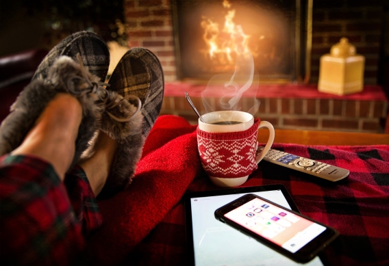 feet relaxing in front of fire with hot chocolate